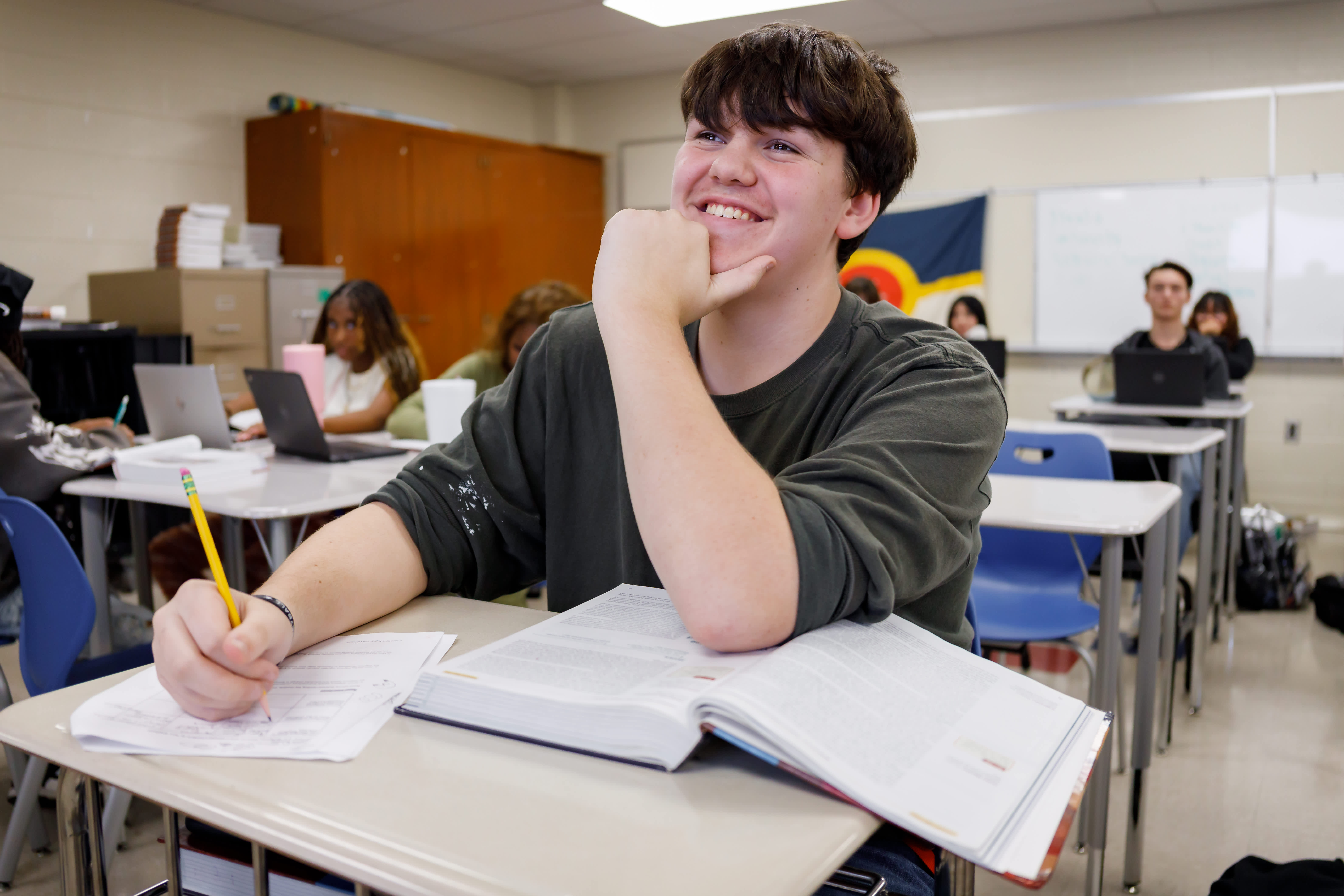 a student smiles in class