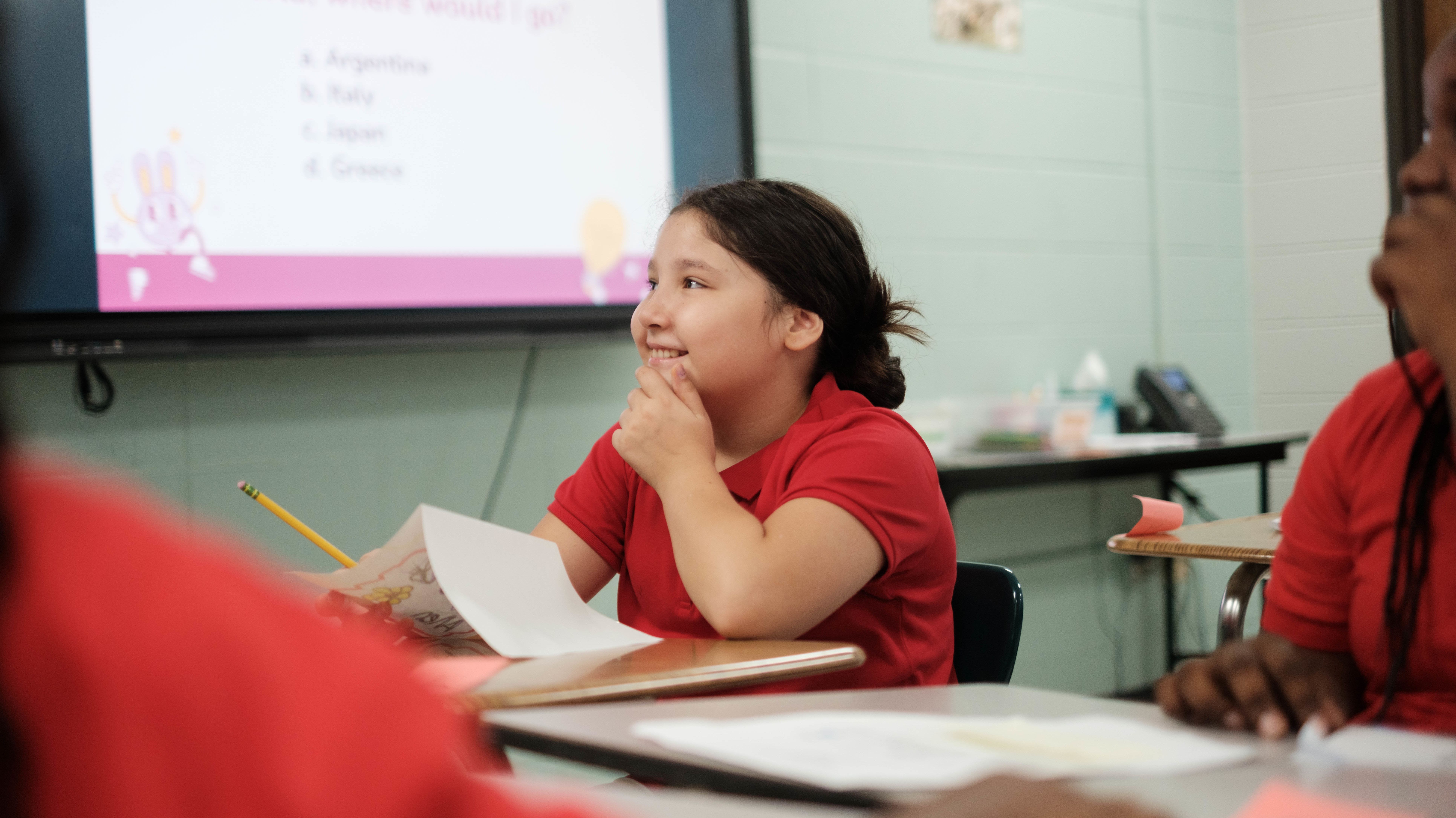 a student smiles in class