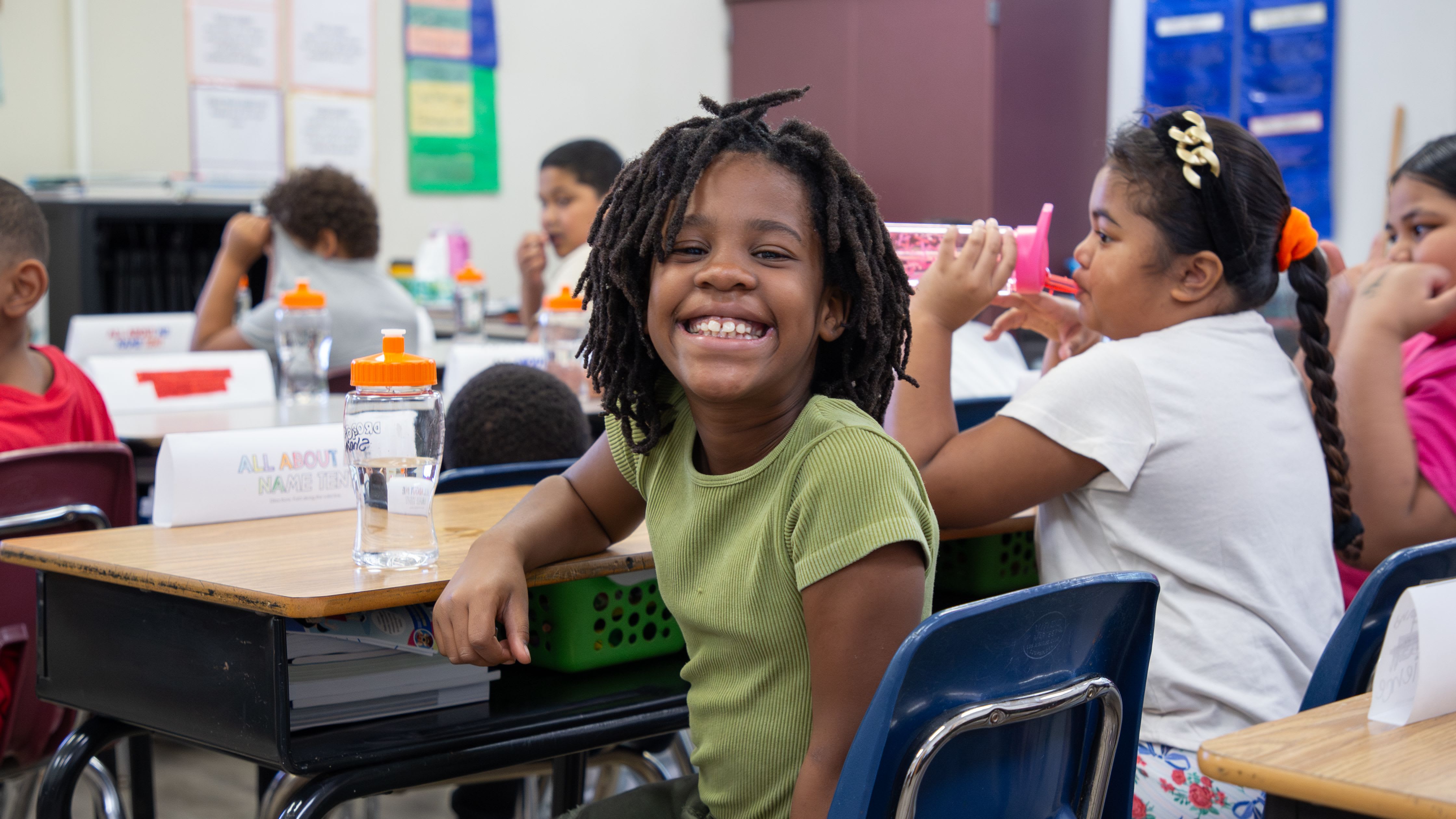 a student smiles in class
