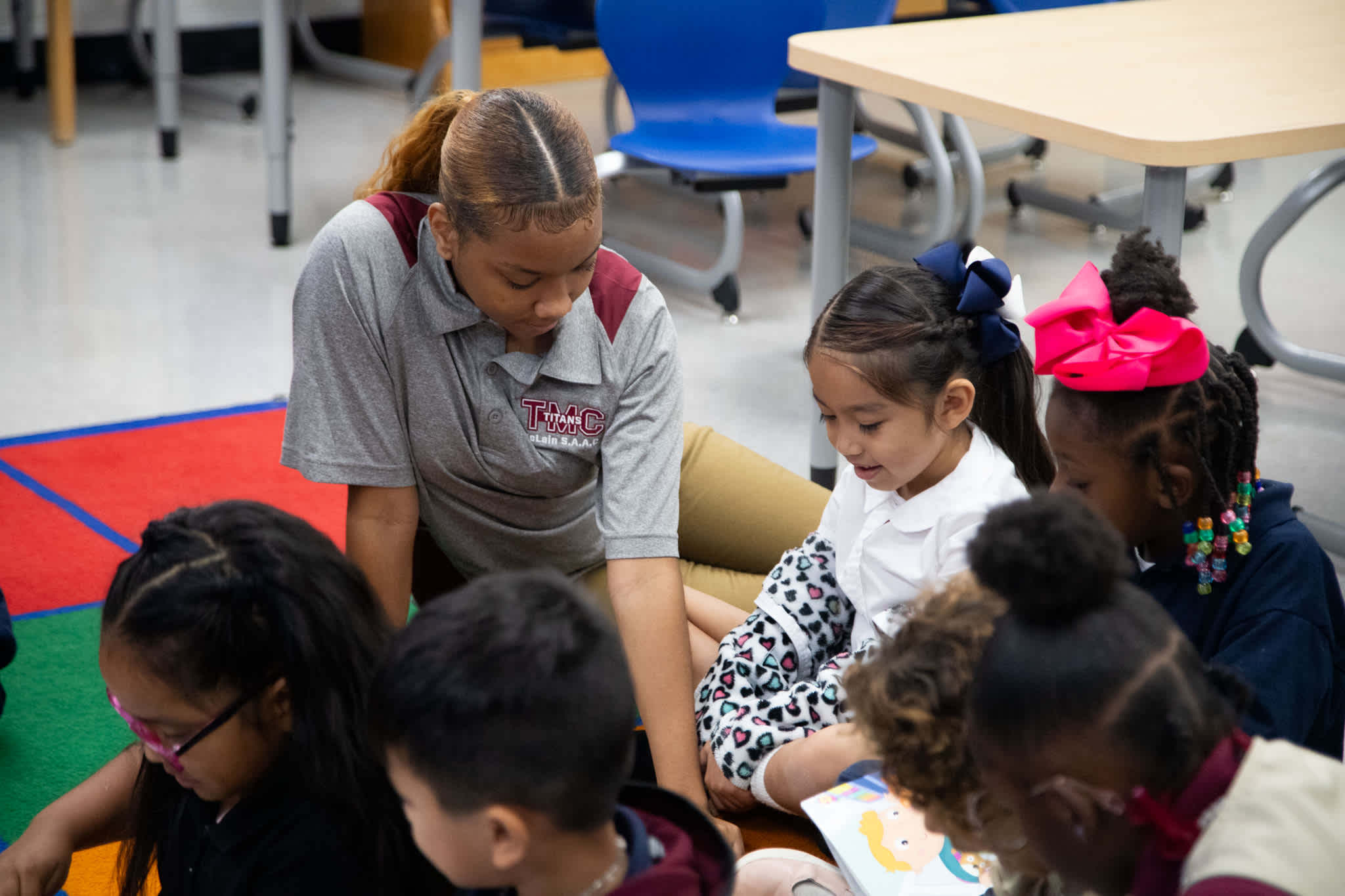 McLain student helps an elementary student with reading